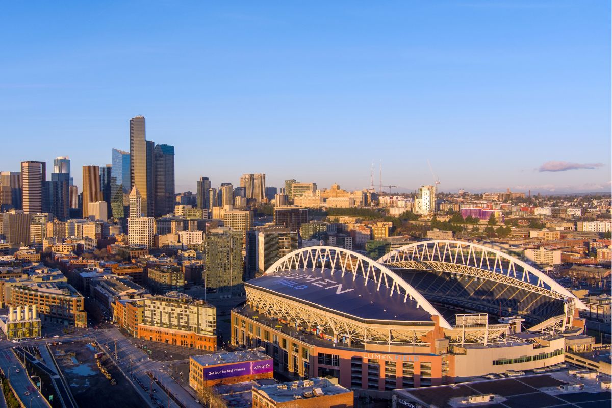 Aerial view of Lumen Field and the downtown Seattle skyline at dusk